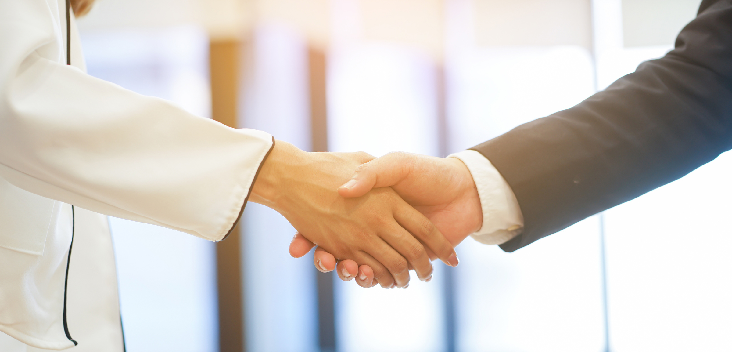 close up  politeness of businesswoman handshake with businessman partner vendor,collaboration of ceo leader hand shake for agreement or deal financial cooperative concept.